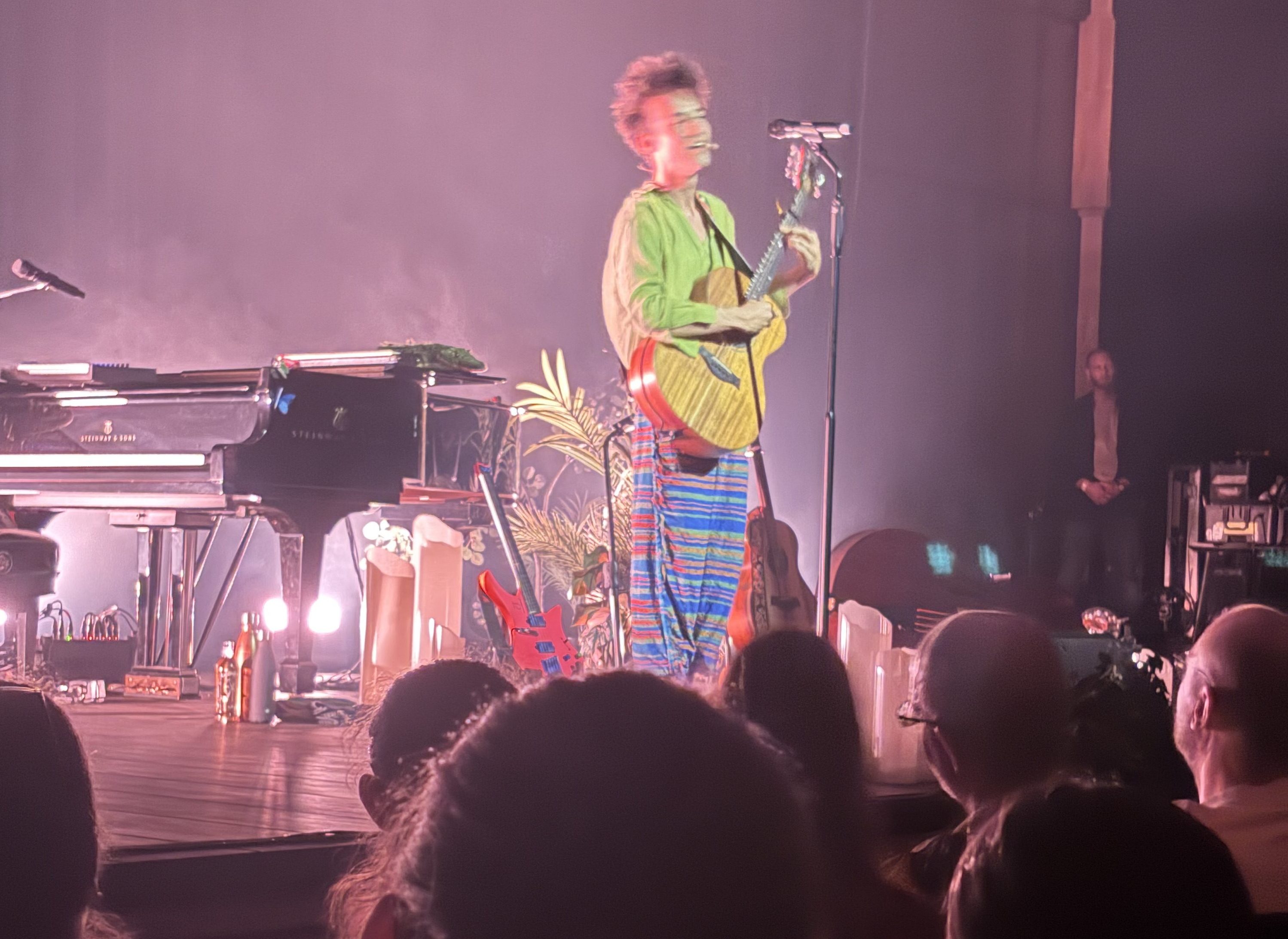 Jacob on stage with his five string guitar.